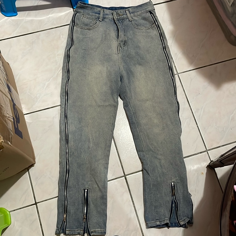 Washed And Distressed Zip Jeans